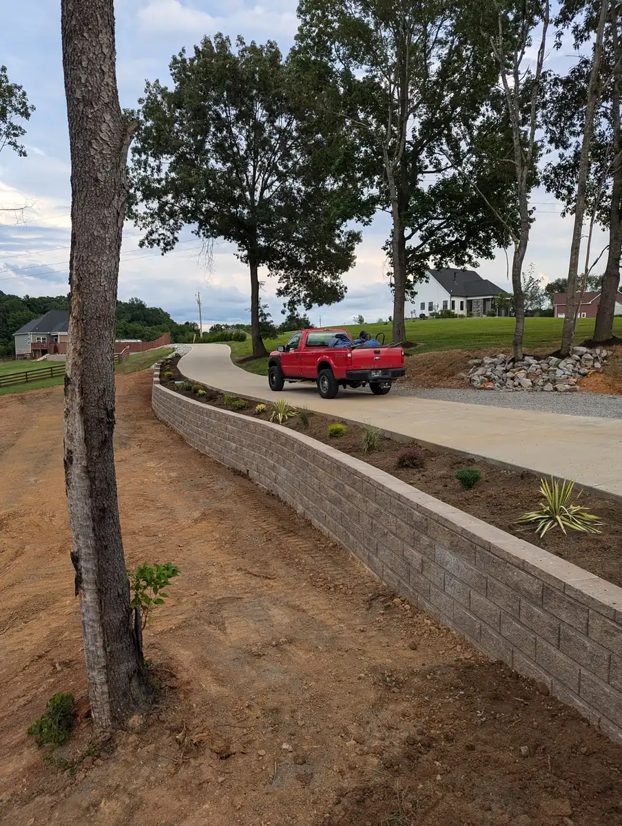 Long block retaining wall running along a residential driveway in Nashville, TN
