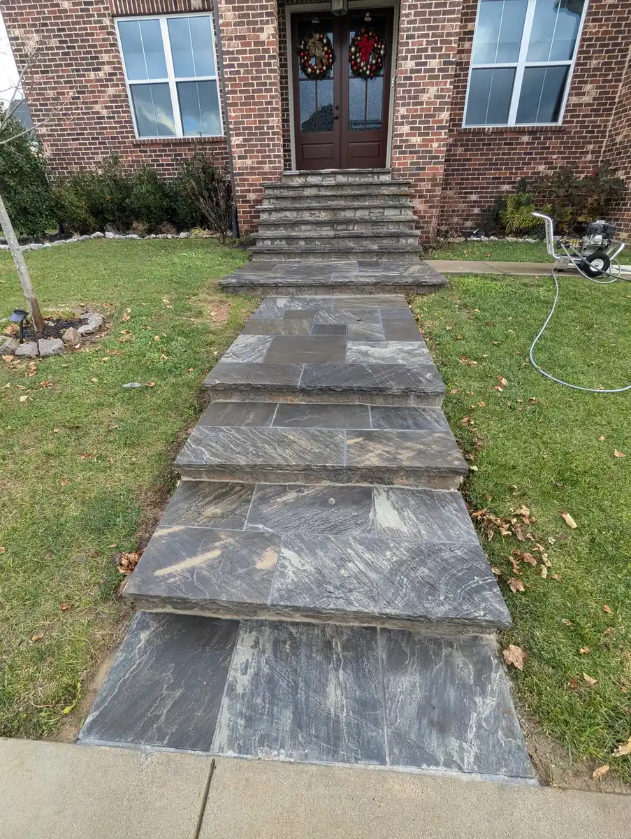 Paver front walkway and steps to the entry of a brick home in Nashville, TN
